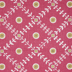 Detail of fabric in a flower and leaf lattice print in yellow and white on a red field.