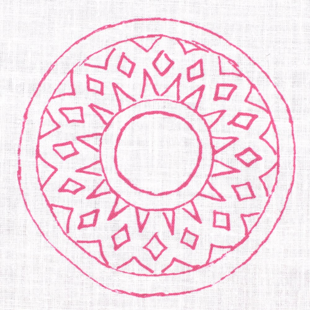 Detail of fabric in a repeating circular geometric print in fuchsia on a white field.