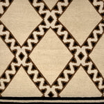 Close-up of a patterned rug with geometric design