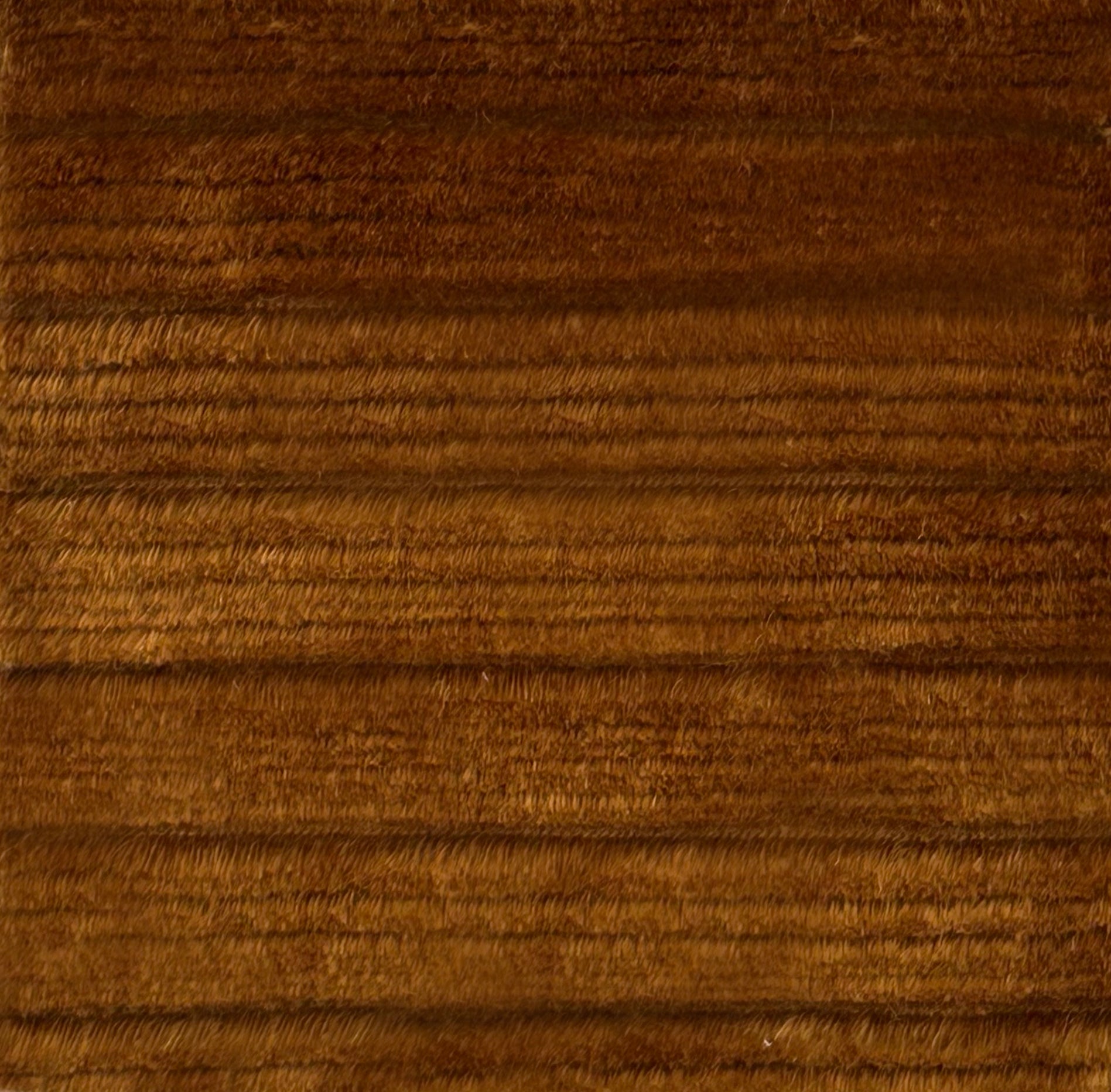 Handknotted rug in stripped shag in solid brown. 