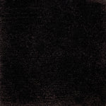 Handknotted cut pile rug in dark brown.