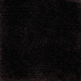 Handknotted cut pile rug in dark brown.