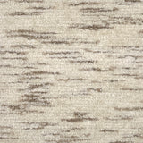 Handknotted cut pile rug in mottled oatmeal and cream.