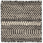 Black and white zigzag patterned rug with boundedges