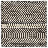 Black and white zigzag patterned rug with boundedges