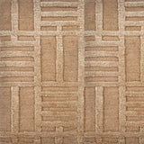 Detail of a Handknotted rug in beige with a raised linear pattern. 