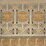 Handknotted rug in an ornate geometric design in yellow, tan and grey on a cream field. 