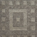 Close-up of a textured brown carpet with geometric pattern