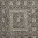 Close-up of a textured brown carpet with geometric pattern