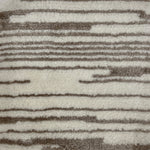Close-up of a textured rug with brown and beige stripes