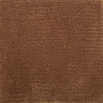Handknotted cut pile rug in rust.