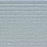 Detail of a handknotted rug in a raised stripe pattern in light grey