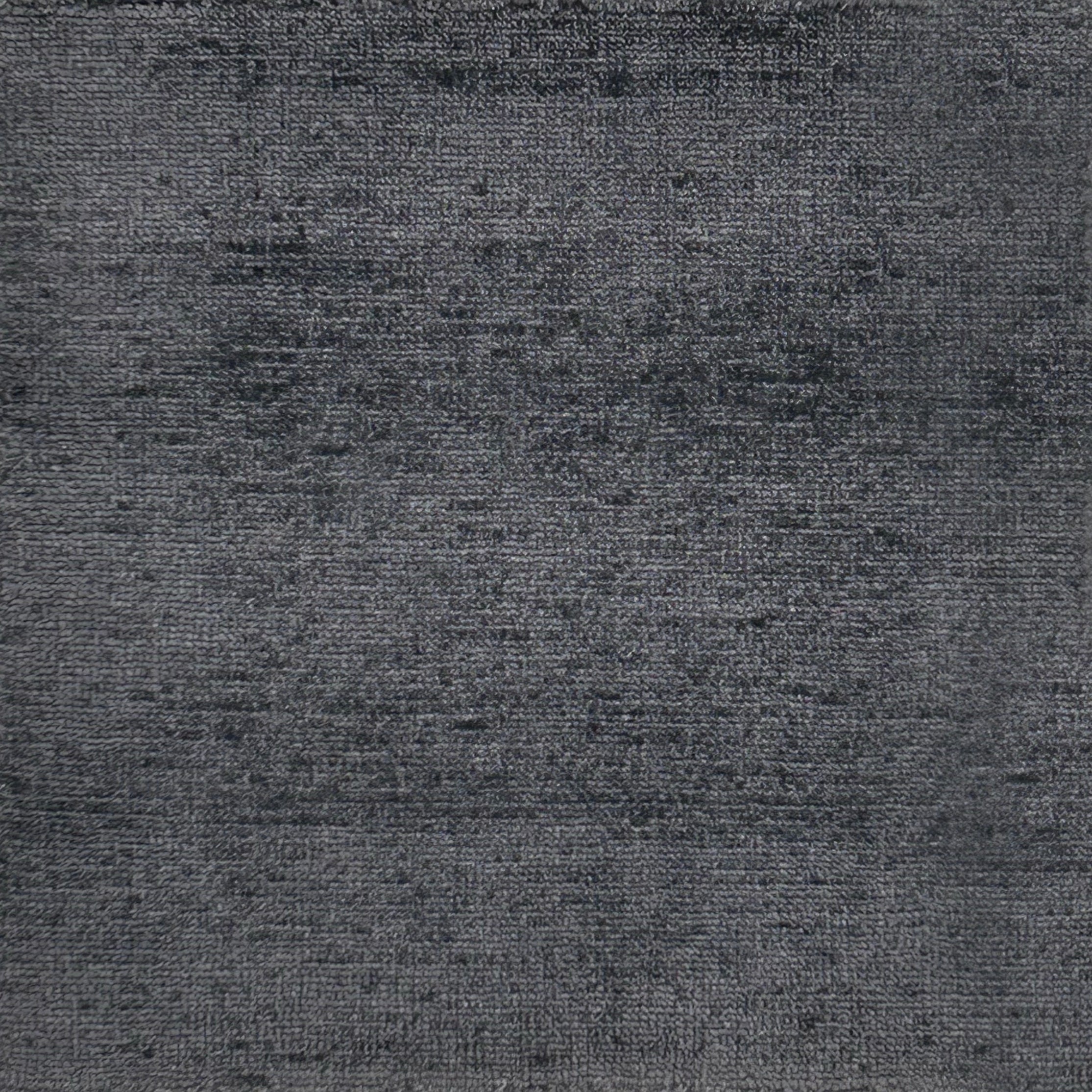 Handknotted rug in charcoal grey. 
