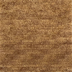 Handknotted cut pile rug in warm tan.