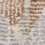 Handknotted Moroccan style rug sample in a textural cream grey and tan pattern.