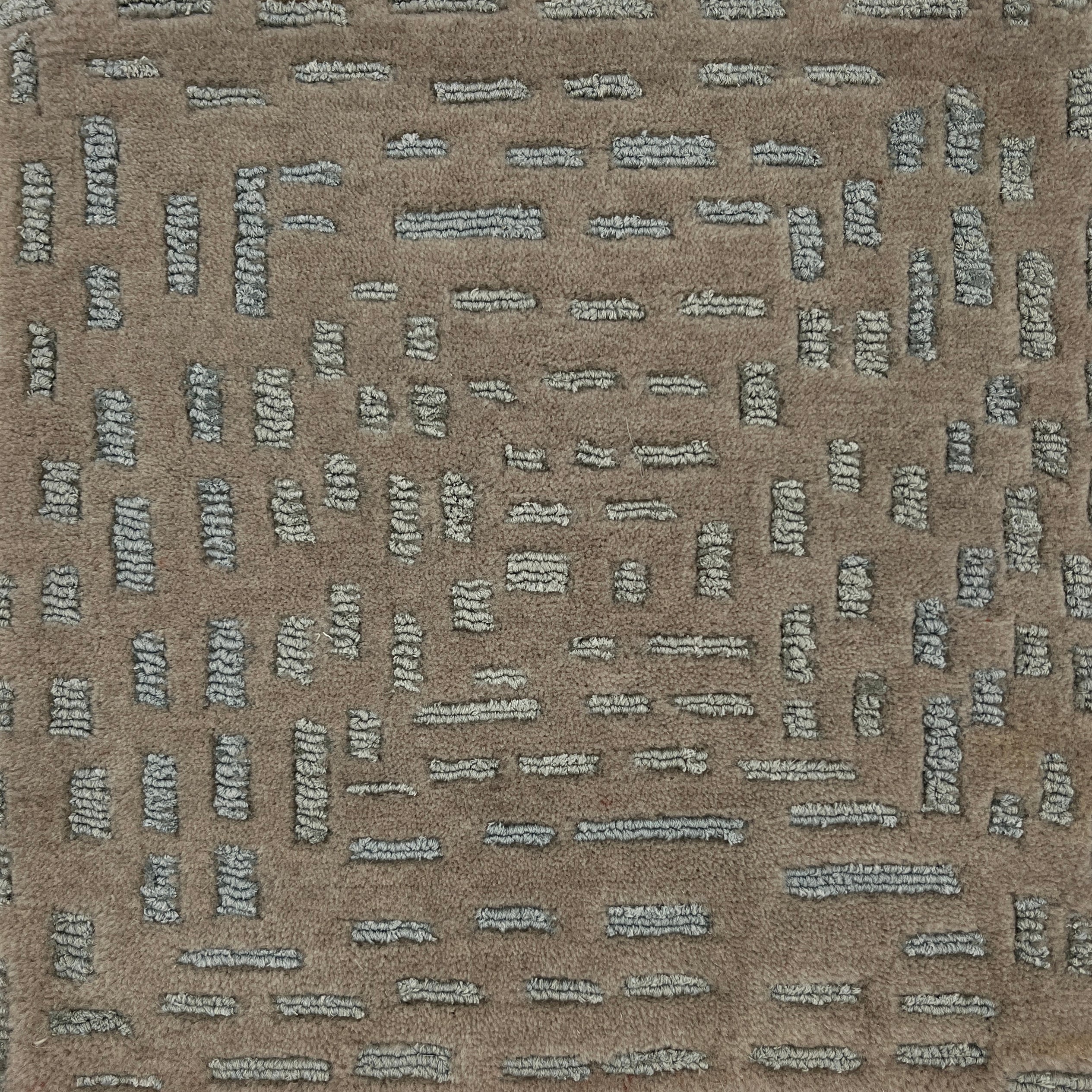 Textured brown carpet with a subtle pattern