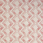 Fabric in a diamond grid pattern in coral on a tan field.