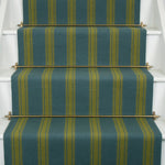 Striped flatweave runner in green and blue on white staircase