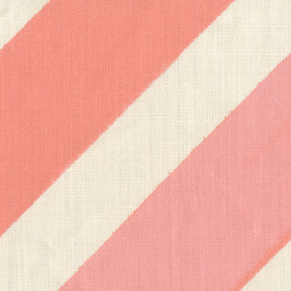 Fabric in a large-scale diagonal stripe print in shades of pink on a cream field.