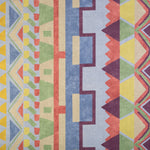 Detail of fabric in a playful geometric stripe in a rainbow of pastel shades.