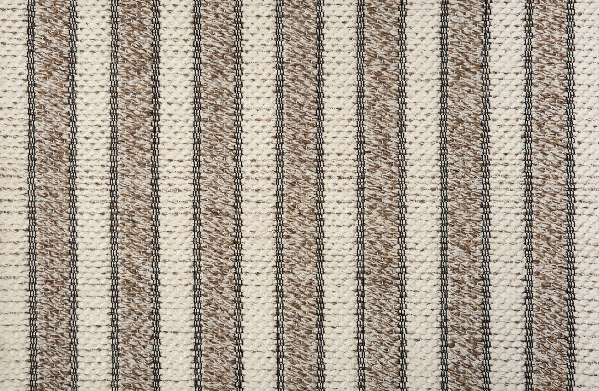 Broadloom carpet with stripes of cream and brown.