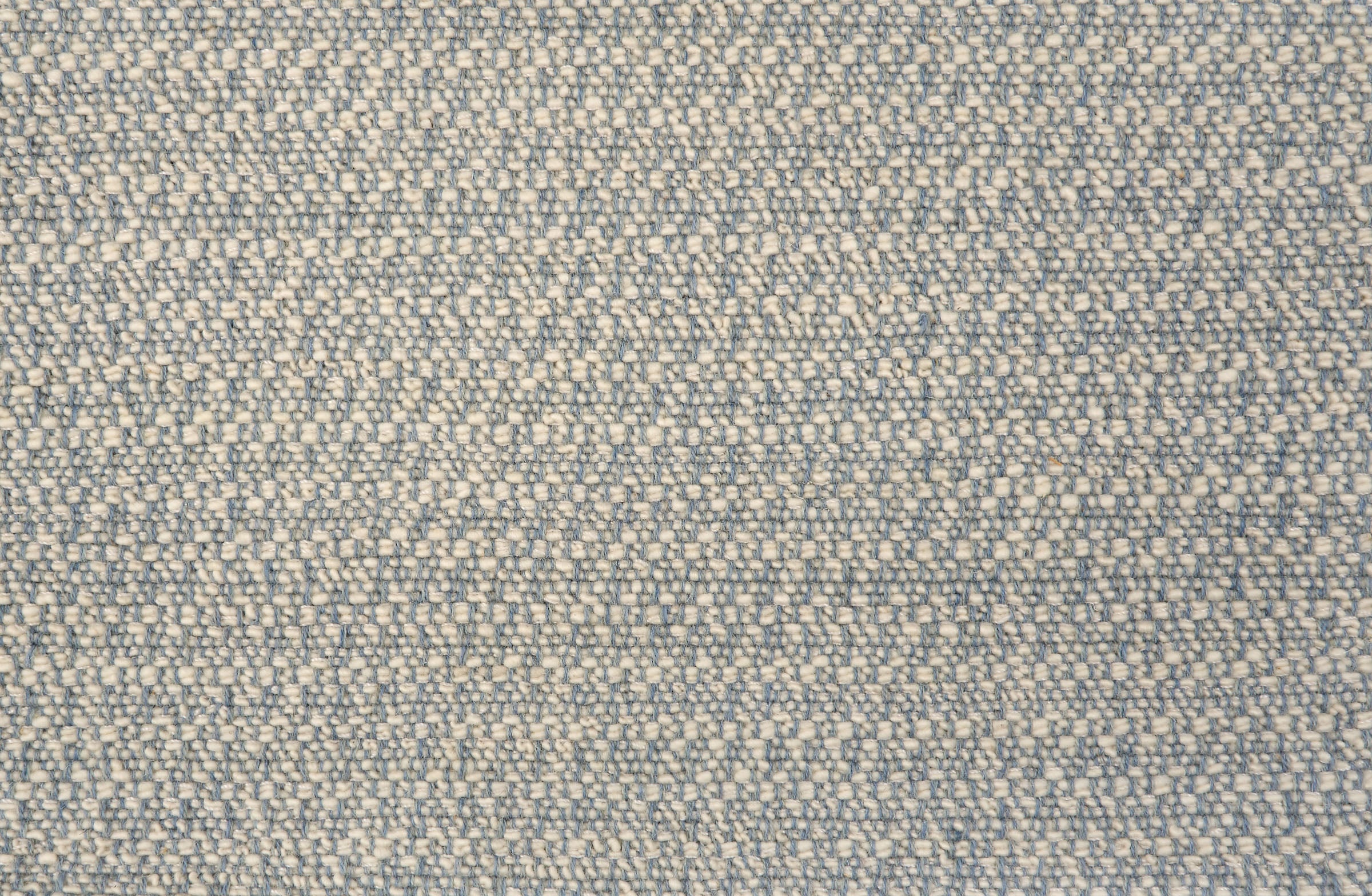 Textured broadloom carpet in sky blue.