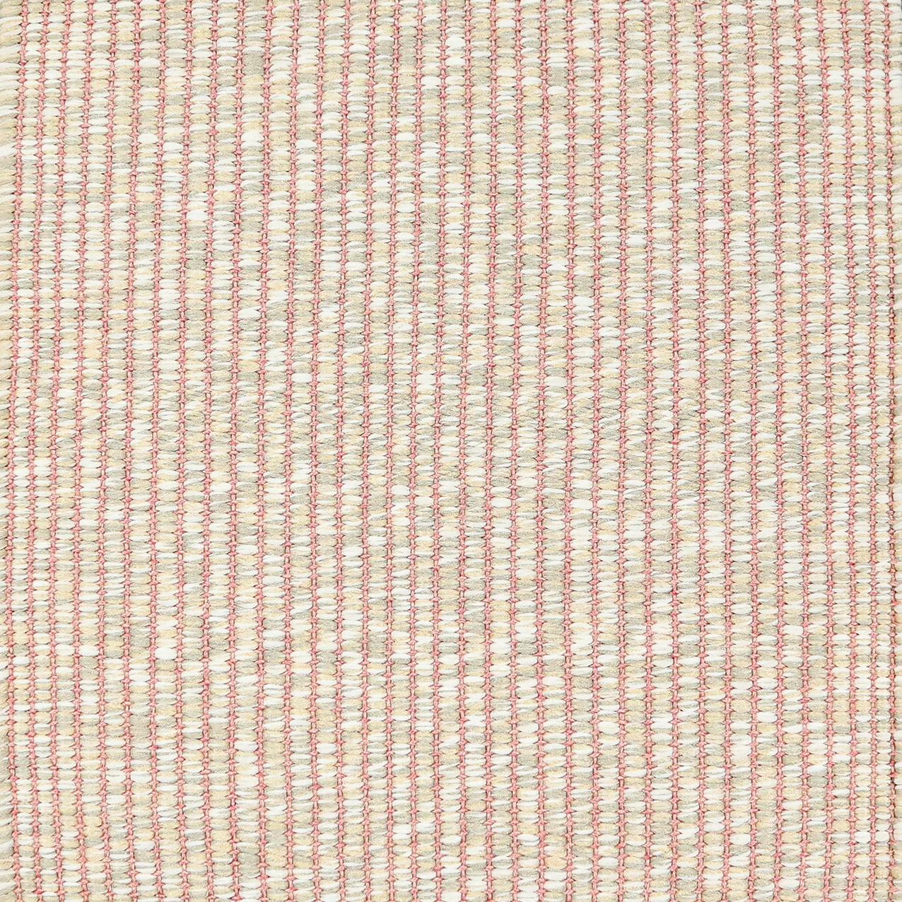 Textured woven outdoor carpet in pink and beige.