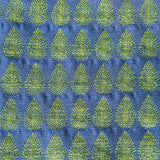 Detail of fabric woven in a repeating leaf print in shades of blue and green.