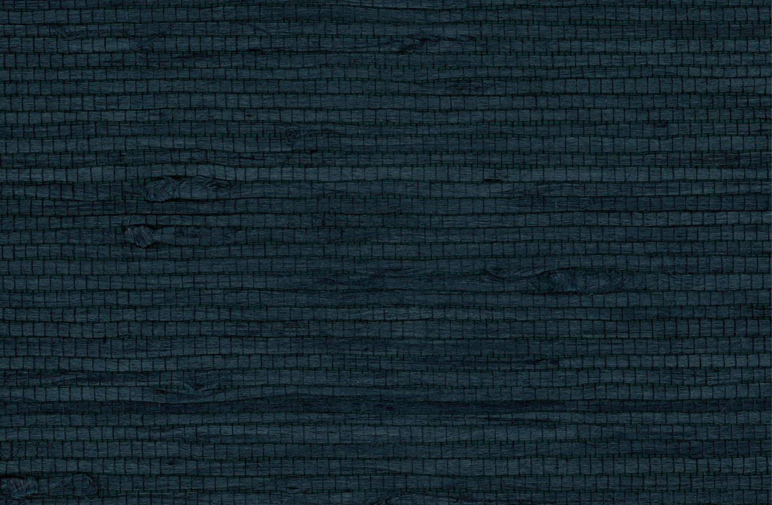 Detail of a jute grasscloth wallpaper in dark navy on a paper backing.