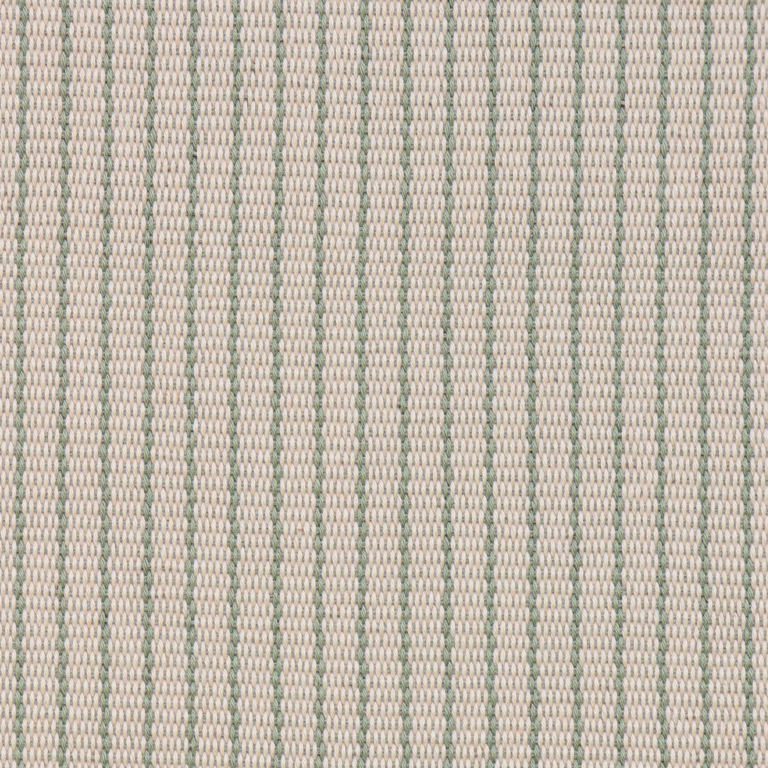 Handwoven fabric detail in a cream and sage green stripe.