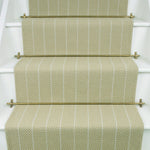 Striped flatweave runner in sage on white staircase