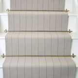 Striped flatweave runner in light grey on white staircase