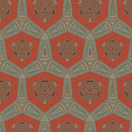 Detail of fabric in a geometric tribal print in shades of turquoise, brown and tan on a red field.