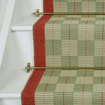 Checks and plaids flatweave runner in green and red on white staircase