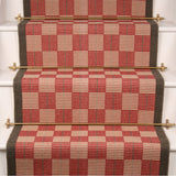 Checks and plaids flatweave runner in red and brown on white staircase