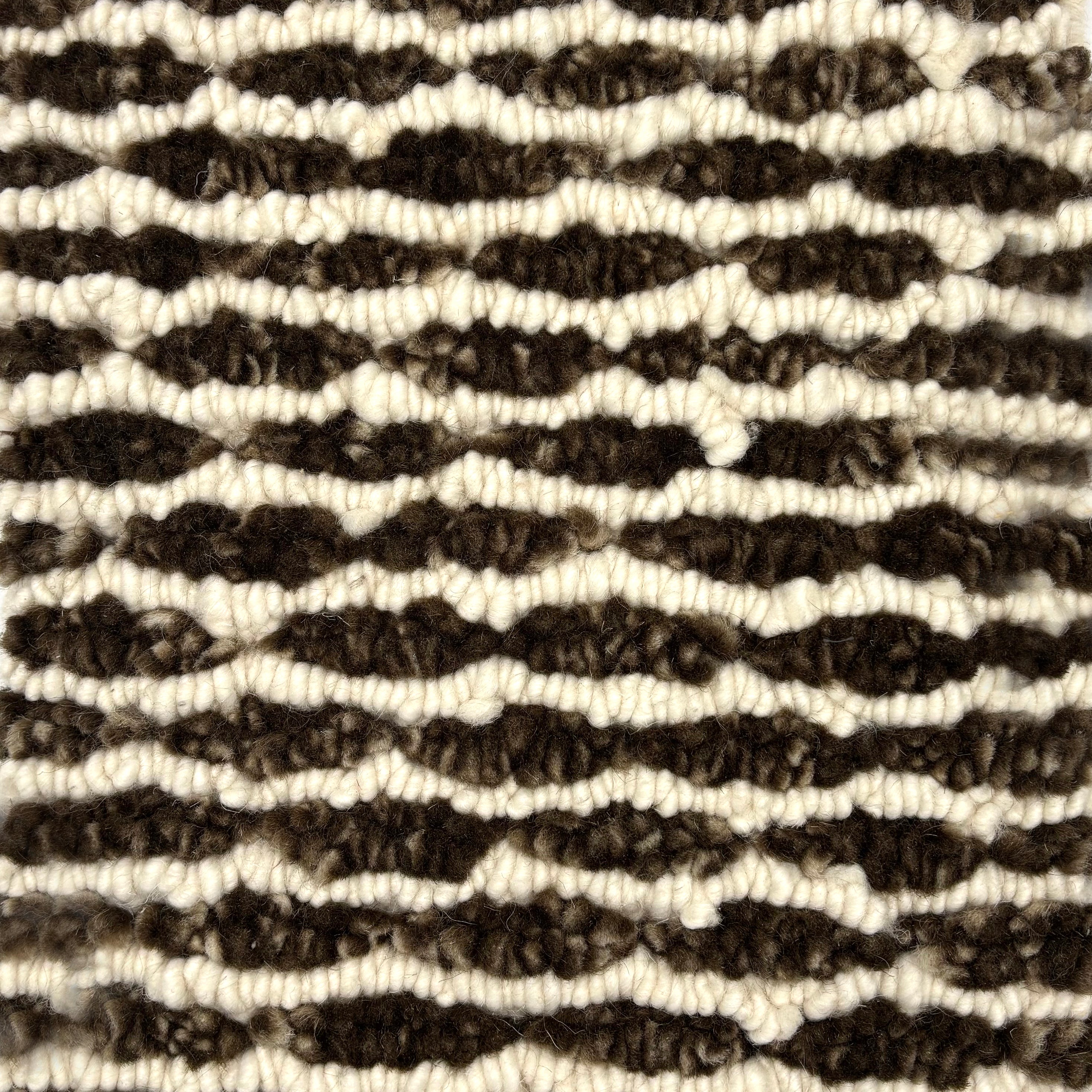 Handknotted rug in a wavy stripe in chocoliate brown and cream. 