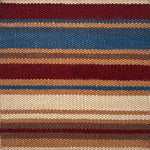 Flatweave rug in a variegated stripe in brown, tan, teal, cream and red. 