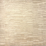 Handknotted rug in a textural hi lo pattern in cut pile and loop in cream. 