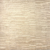 Handknotted rug in a textural hi lo pattern in cut pile and loop in cream. 