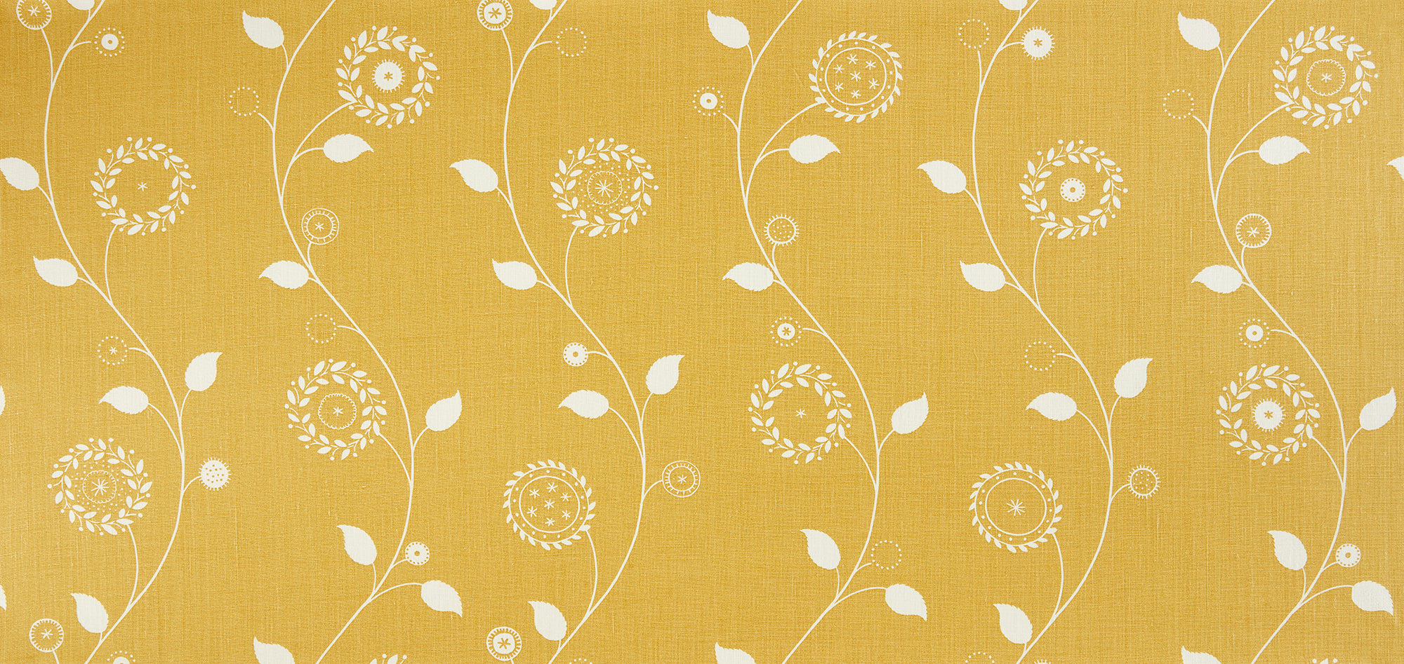 Detail of fabric in a playful floral stripe in white on a mustard field.