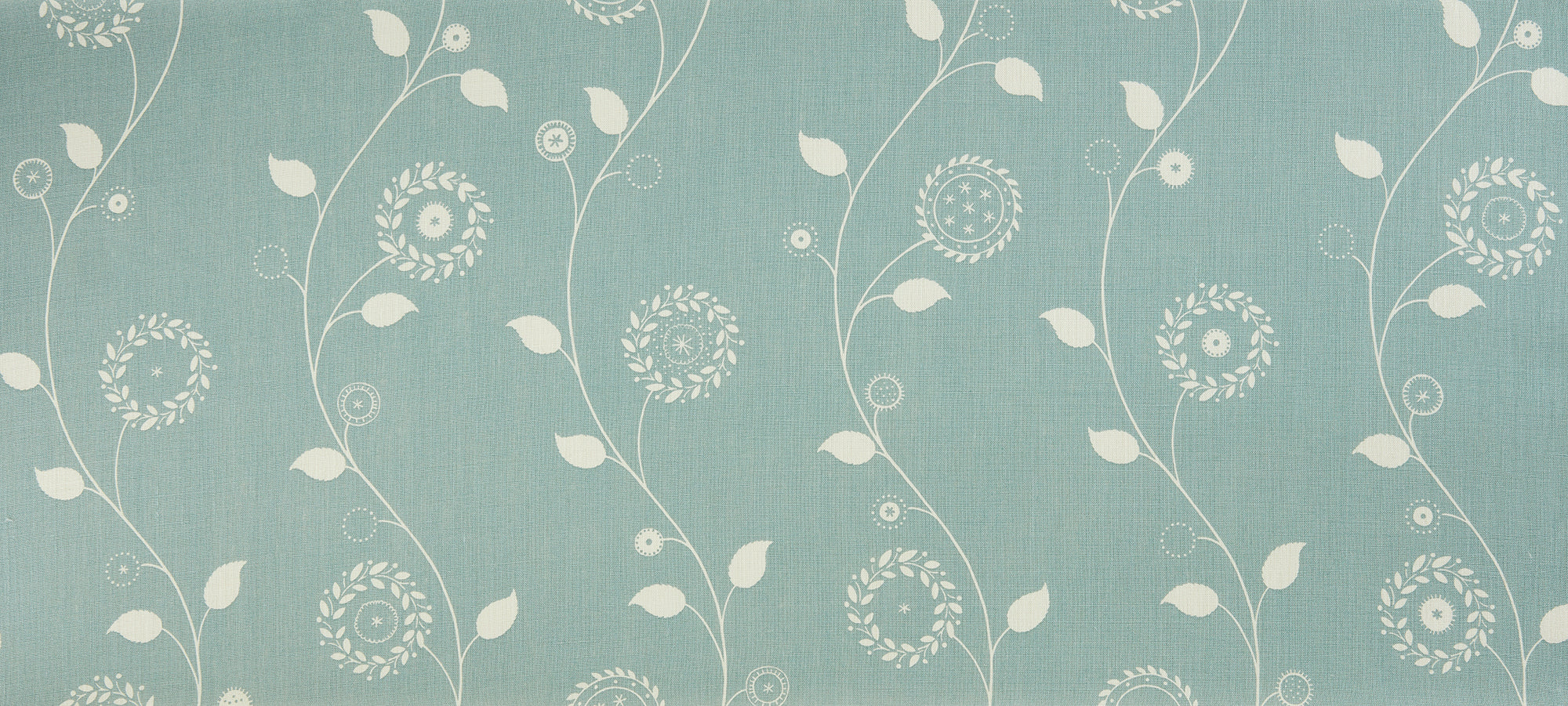 Detail of fabric in a playful floral stripe in white on a light turquoise field.