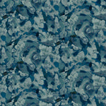 Detail of fabric in an abstract paint print in shades of blue, navy and turquoise.