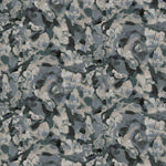 Detail of fabric in an abstract paint print in shades of blue, gray and cream.