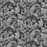 Detail of fabric in an abstract paint print in shades of blue, gray and cream.