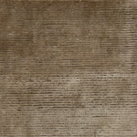 Handknotted cutpile rug in brown.