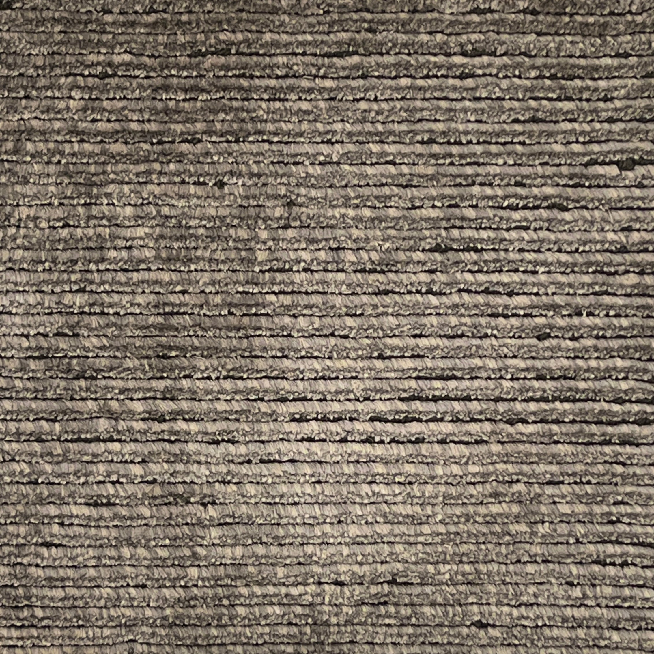 Handknotted cutpile rug in warm grey.