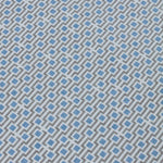 Detail of a wallpaper panel in a geometric grid print in shades of blue and gray.