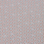 Detail of a wallpaper panel in a geometric grid print in shades of pink and gray.