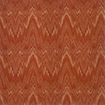 Handknotted rug with wavy lines in shades of red and orange.