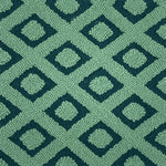 Patterned green rug with geometric design
